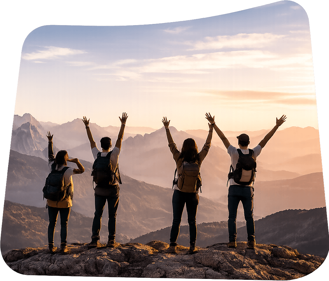 Travellers celebrating on a mountain summit